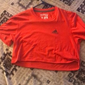 A hot orange / pink crop top from adidas